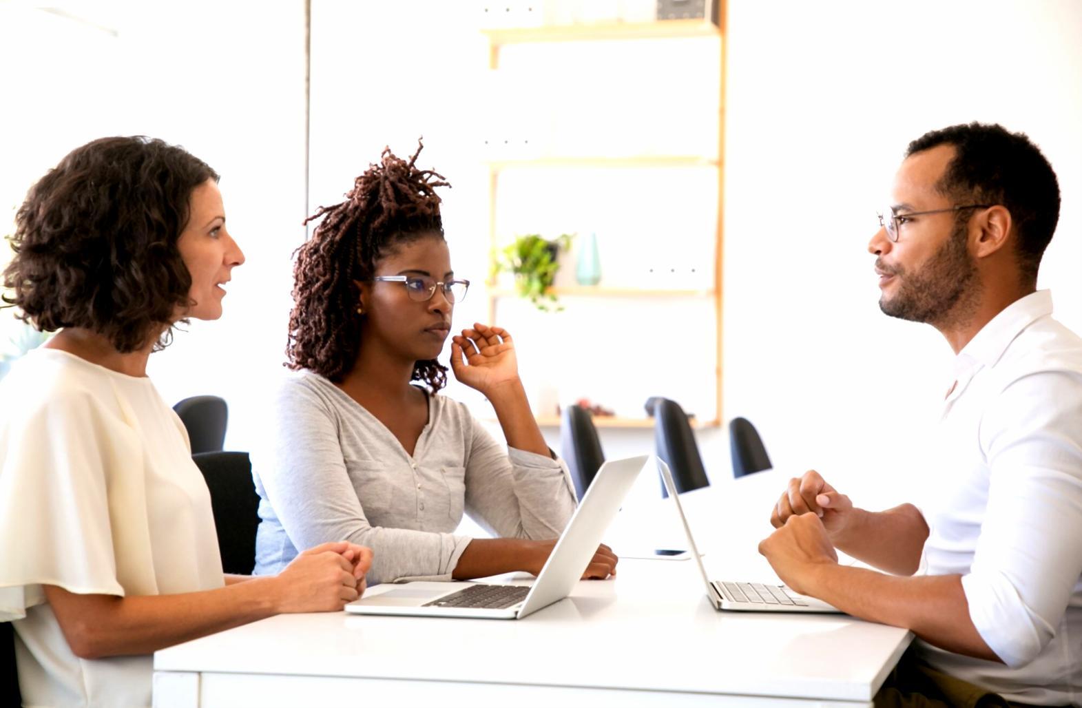 Group of professionals collaborating on budget planning exercises